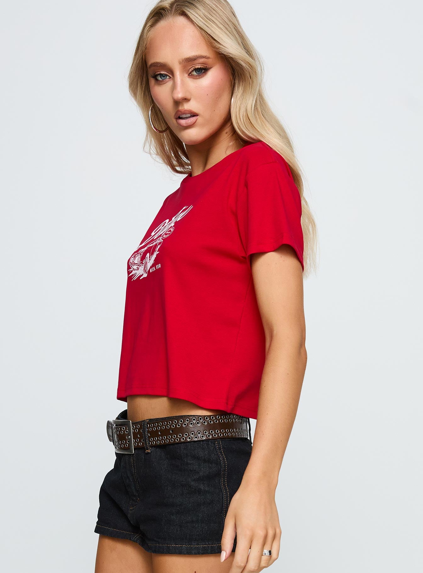 side view of model wearing Princess Polly Dodge Classic Graphic Top Red Short Sleeves Crew Neck 
