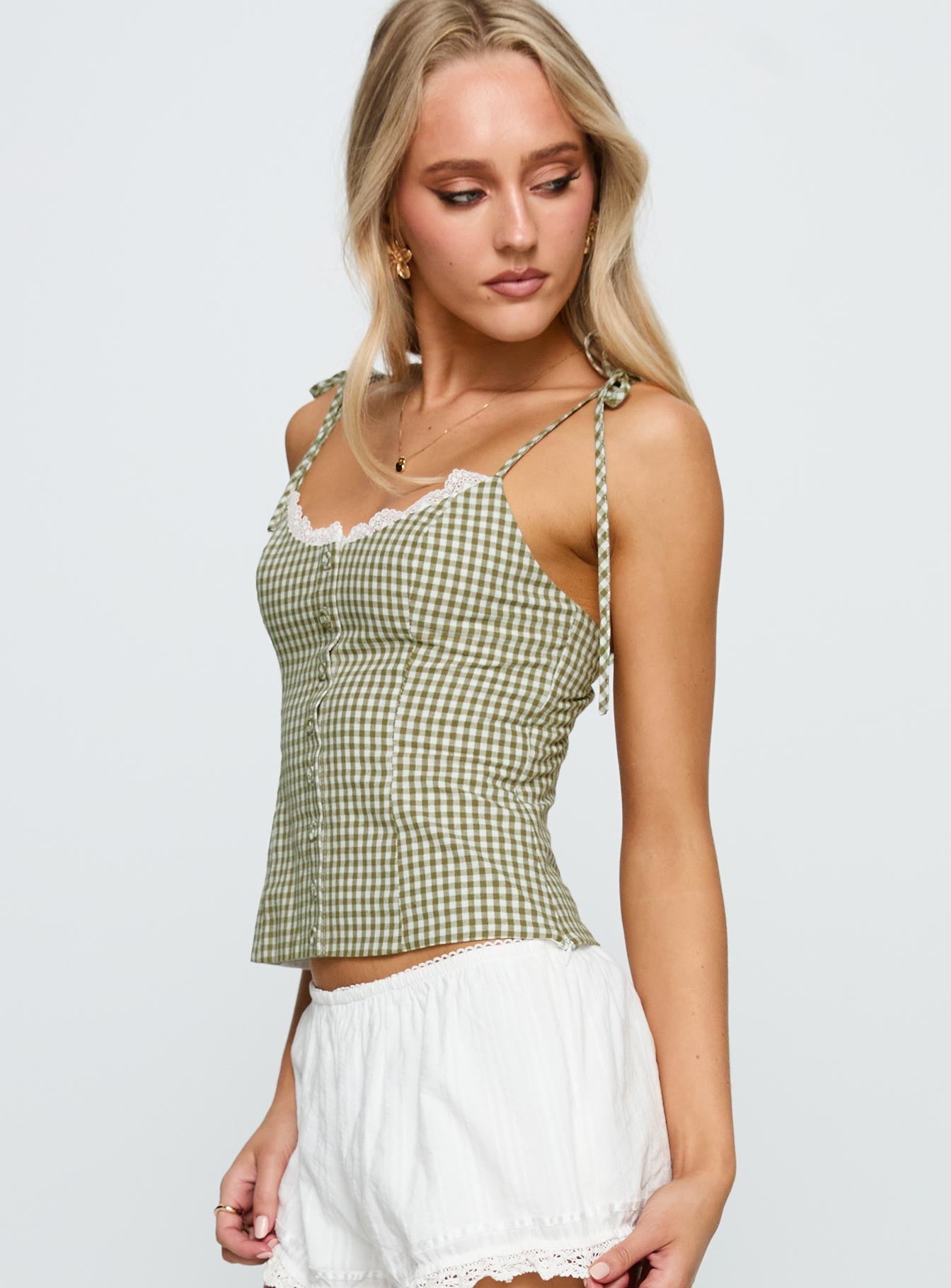 side view of model wearing Princess Polly Dalanie Tie Strap Top Green Check Sleeveless Scoop Neck 