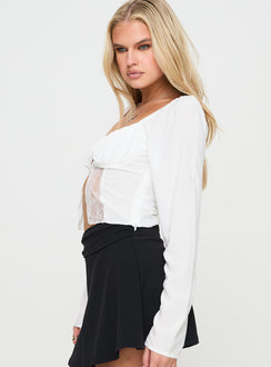 side view of model wearing Princess Polly Kenzler Long Sleeve Top White Full Sleeves Sweetheart 