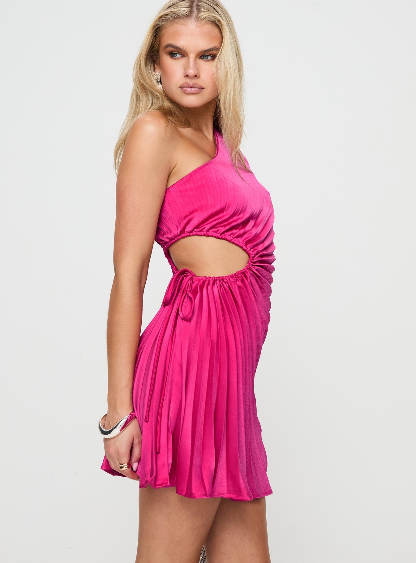 side view of model wearing Princess Polly Celestina One Shoulder Mini Dress Pink Asymmetric Neckline 