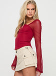 side view of model wearing Princess Polly Mendi Long Sleeve Top Red Full Sleeves Square Neck 