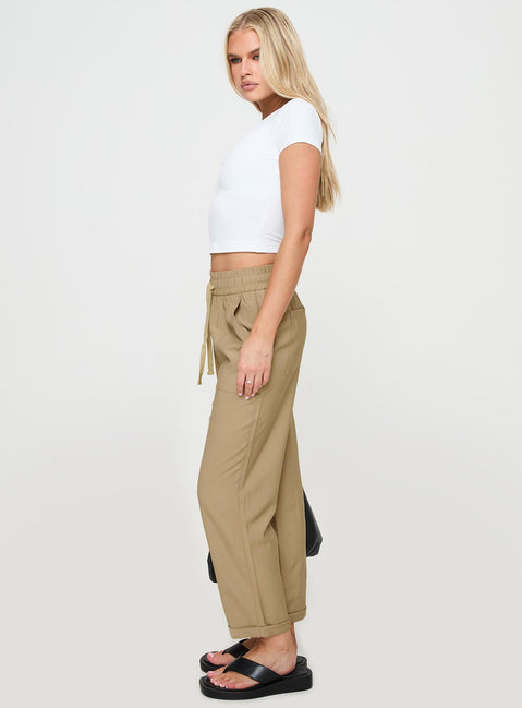 side view of model wearing Princess Polly Tillas Pants Beige High Waisted Pants 