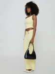   side view of model wearing Princess Polly Whiley Maxi Skirt Cream Maxi 