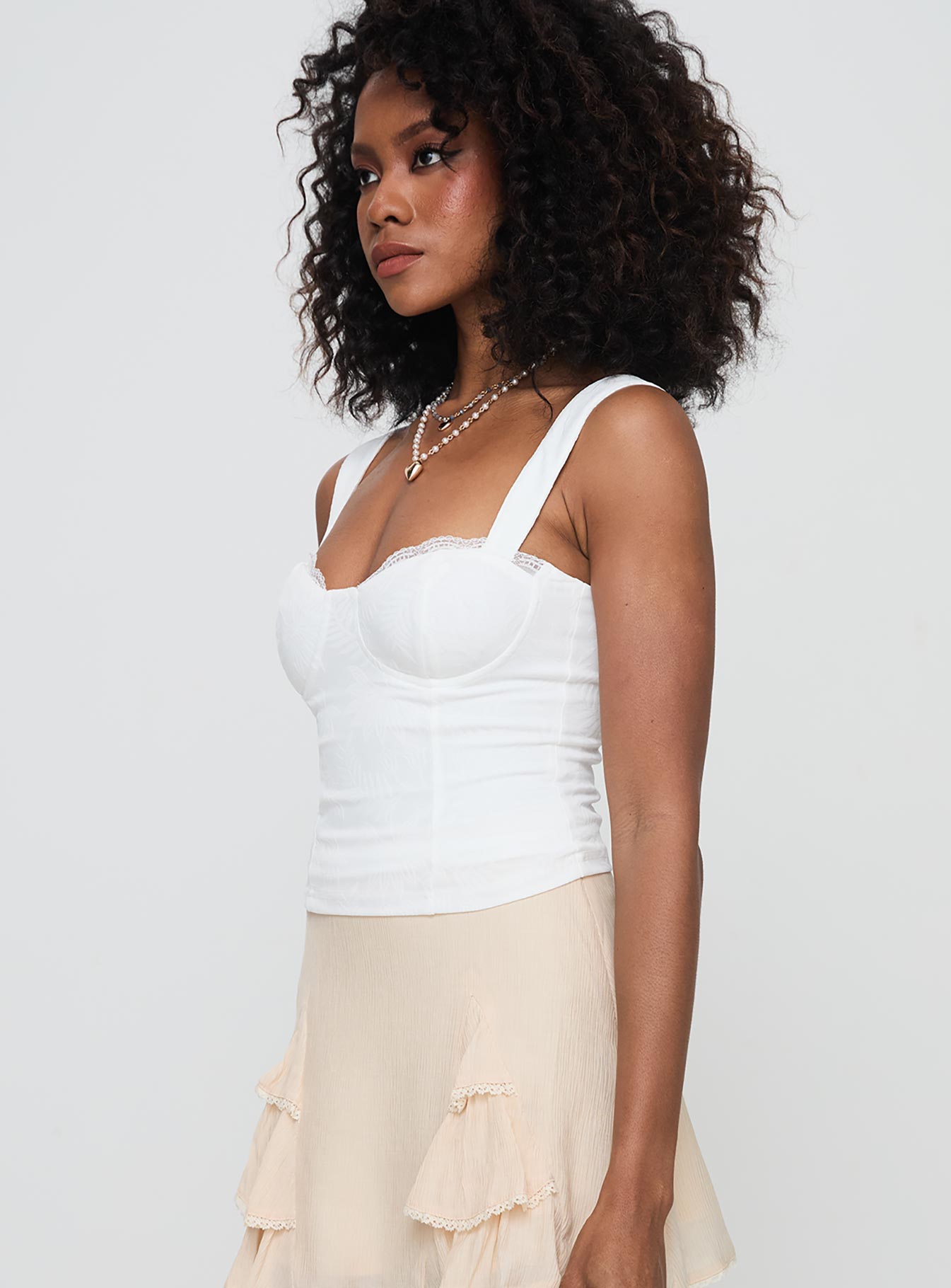 side view of model wearing Princess Polly Hazeel Top White Sleeveless Sweetheart 