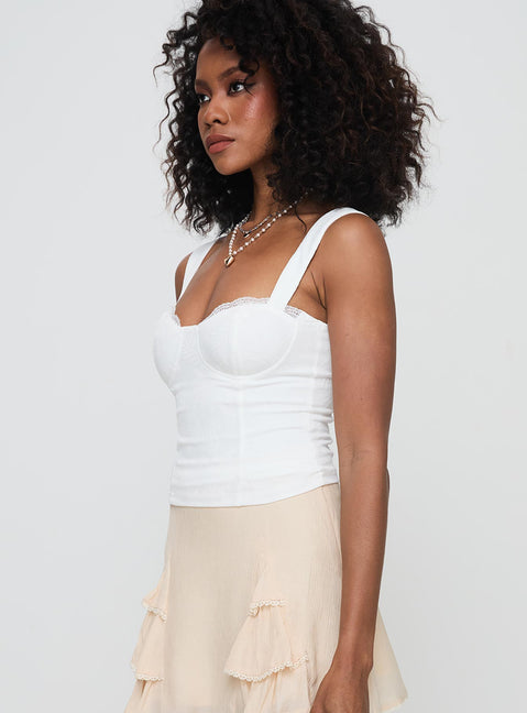 side view of model wearing Princess Polly Hazeel Top White Sleeveless Sweetheart 