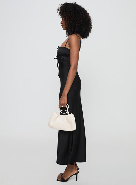 side view of model wearing Princess Polly Jaquelin Maxi Dress Black Square Neck 