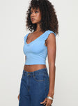 side view of model wearing Princess Polly Sharnee Top Blue Short Sleeves Scoop Neck 