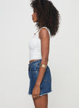 side view of model wearing Princess Polly Crystal Bay Skort Mid Wash High Waisted Shorts 