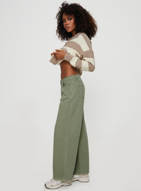 side view of model wearing Princess Polly Ramos Low Rise Denim Jeans Sage Mid Rise 