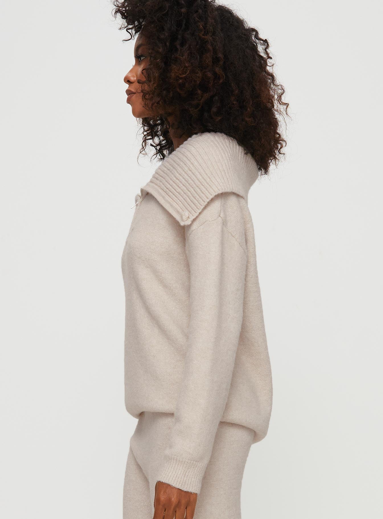 side view of model wearing Princess Polly Umanzor Quarter Zip Sweater Beige regular 