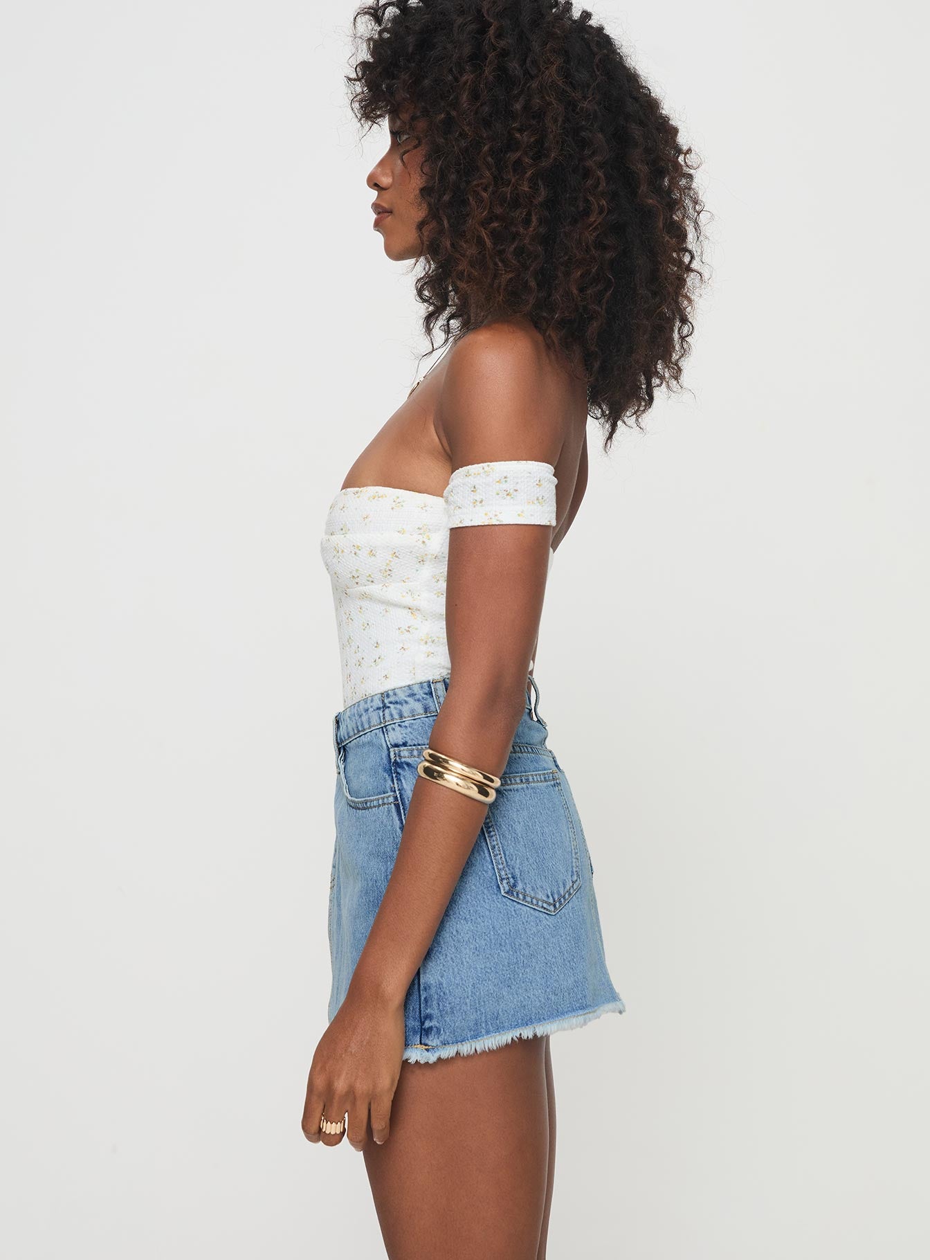  side view of model wearing Princess Polly Barbuto Denim Wrap Mini Skirt Light Wash Mini Skirts 