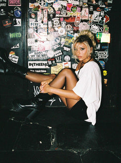 side view of model wearing Princess Polly Kippa Off The Shoulder Tee White Half Sleeves Asymmetric Neckline 