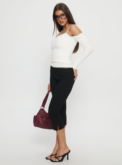 side view of model wearing Princess Polly Baseline Rib Capri Pants Black High Rise Pants 