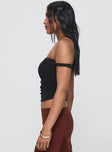 side view of model wearing Princess Polly Messenger One Shoulder Top Black Sleeveless Asymmetric Neckline 