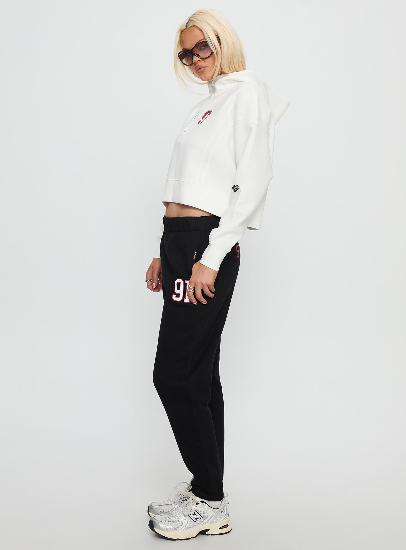 side view of model wearing Princess Polly Stanford Basic Sweatpants Black High Rise Pants 