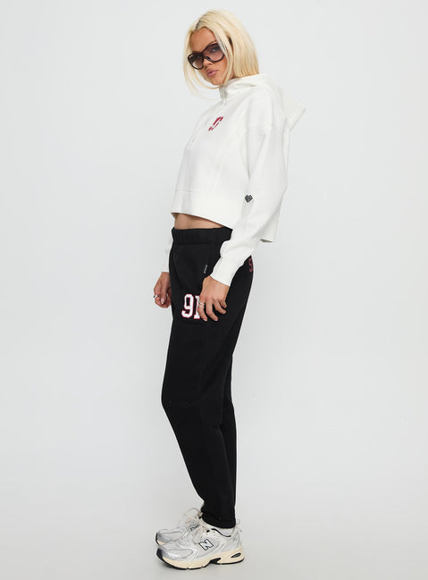 side view of model wearing Princess Polly Stanford Basic Sweatpants Black High Rise Pants 