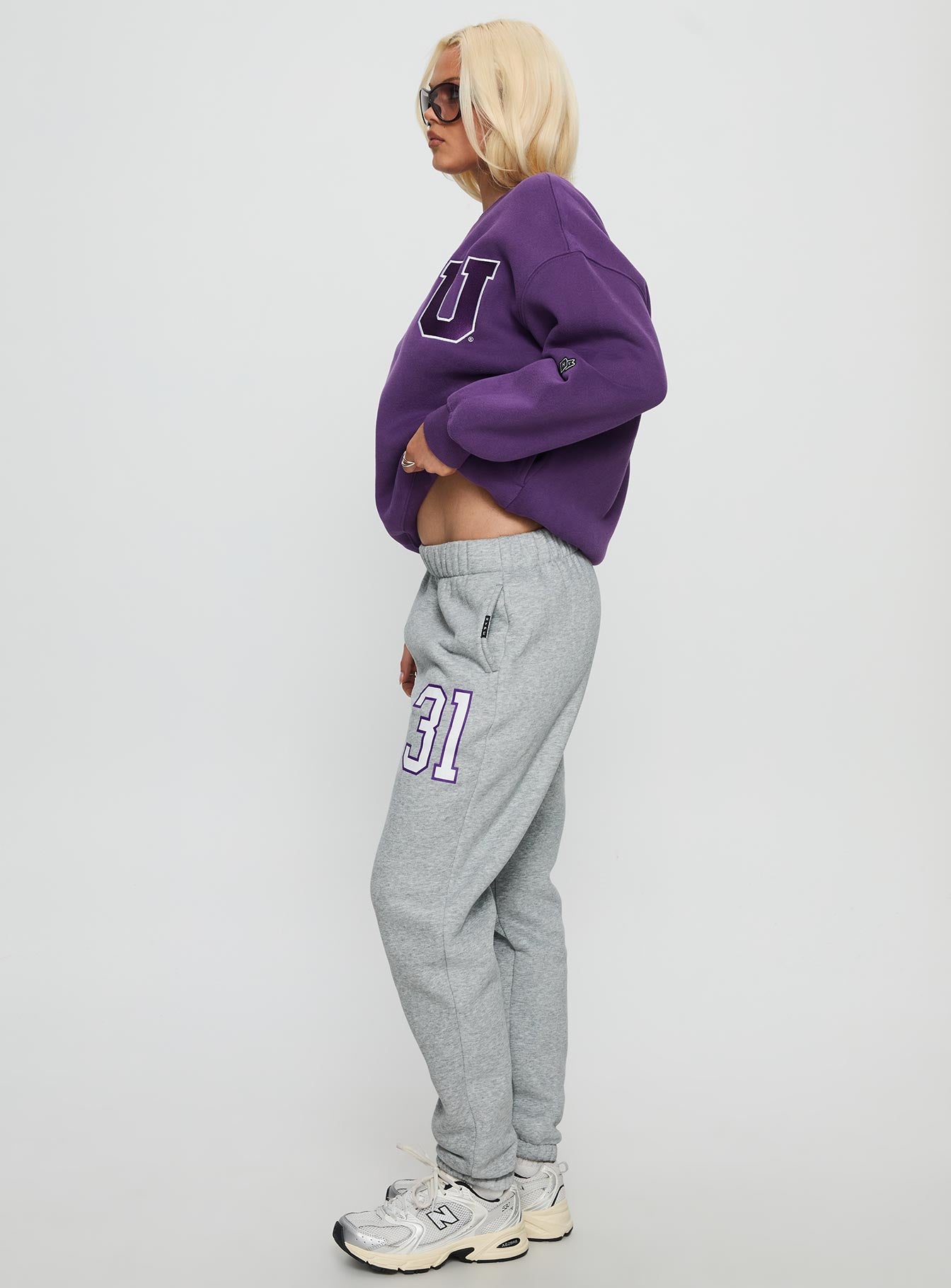 side view of model wearing Princess Polly NYU Basic Sweatpants Heather Grey Mid Rise Pants 