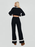 back view of model wearing Princess Polly Montenegro Knit Pants Black / Cream 