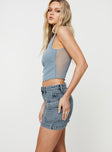   side view of model wearing Princess Polly Zakai Cargo Denim Mini Skirt Light Blue Tall Mini Skirts 