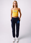 front view of model wearing Princess Polly UCLA Sweatpants Navy High Waisted Pants 