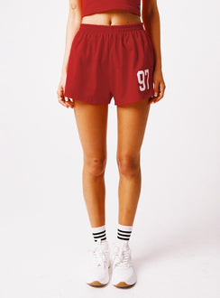 front view of model wearing Princess Polly SDSU Soffee Shorts Red High Waisted Shorts 