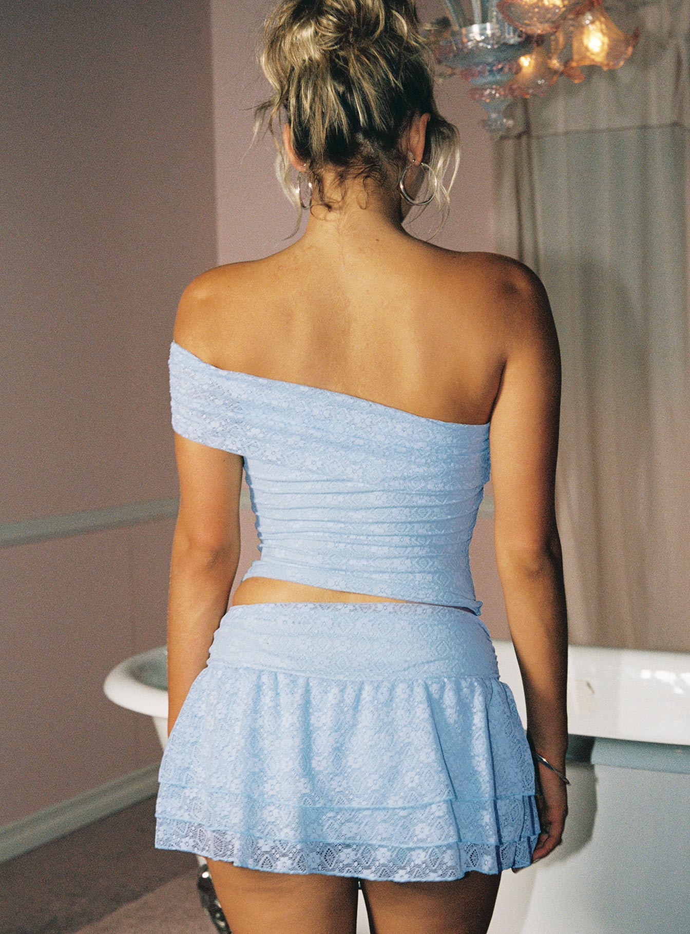 back view of model wearing Princess Polly Believe In Paradise Off Shoulder Mesh Top Blue Sleeveless Asymmetric Neckline 