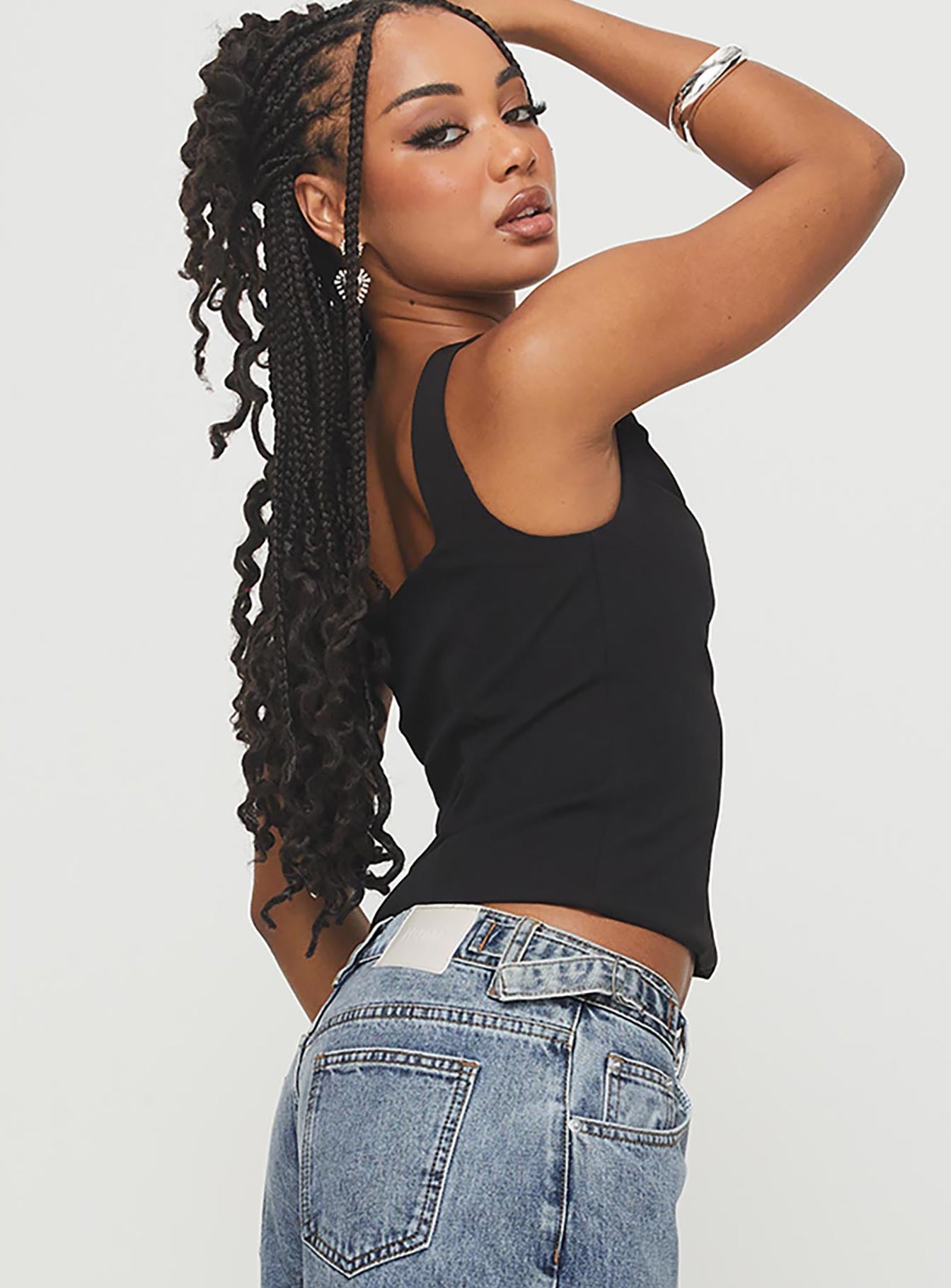 side view of model wearing Princess Polly Lallina Top Black Sleeveless Square Neck 