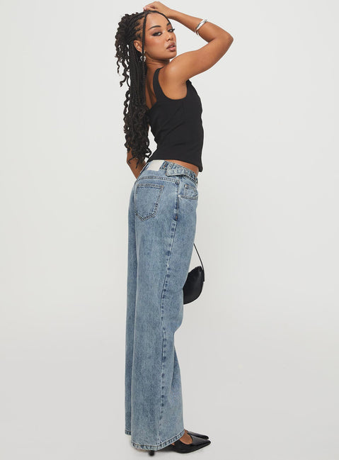 side view of model wearing Princess Polly Sidle Low Rise Jeans Light Wash Low Rise Jeans 