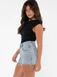 side view of model wearing Princess Polly Laurena Denim Shorts Petite Lower Impact High Waisted Shorts 