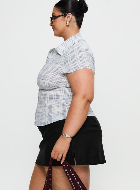 side view of model wearing Princess Polly Cottesloe Blouse Top Blue Check Curve Short Sleeves V-Neck 