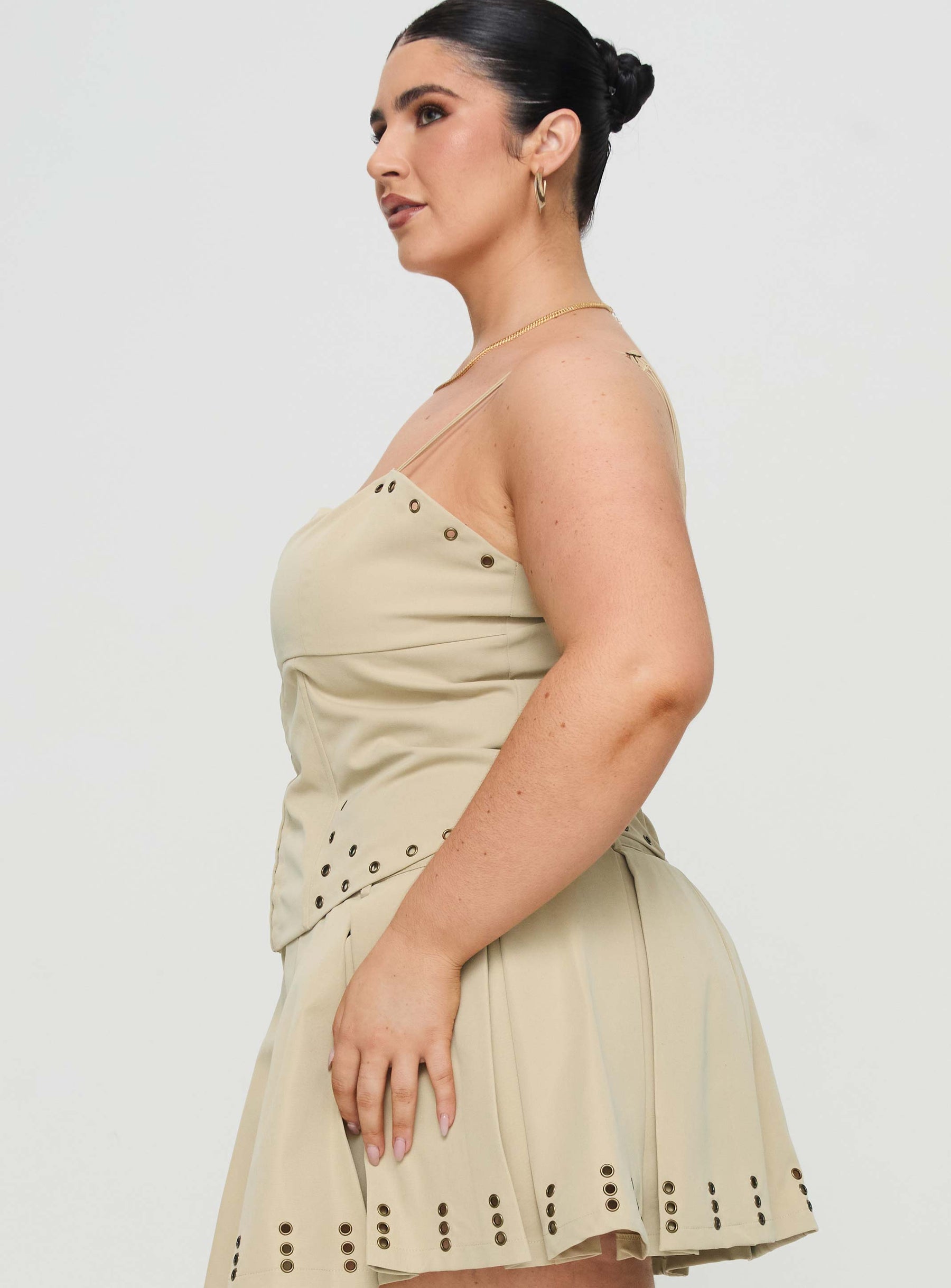 side view of model wearing Princess Polly Alinzia Eyelet Corset Top Beige Curve Sleeveless Square Neck 