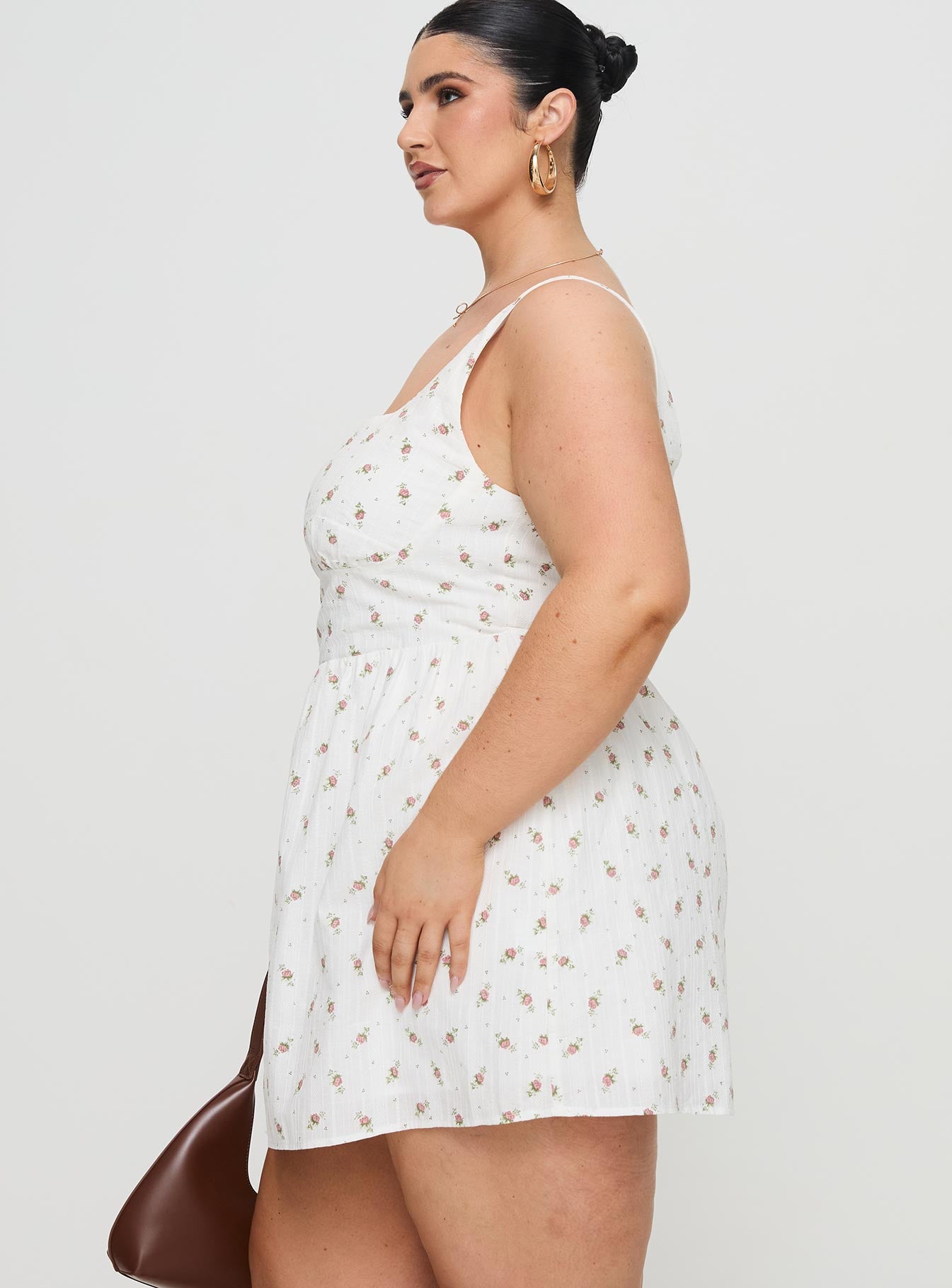 side view of model wearing Princess Polly Samana Mini Dress White Curve Square Neck 