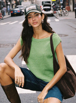 side view of model wearing Princess Polly Ashfield Off Shoulder Top Green Short Sleeves Asymmetric Neckline 