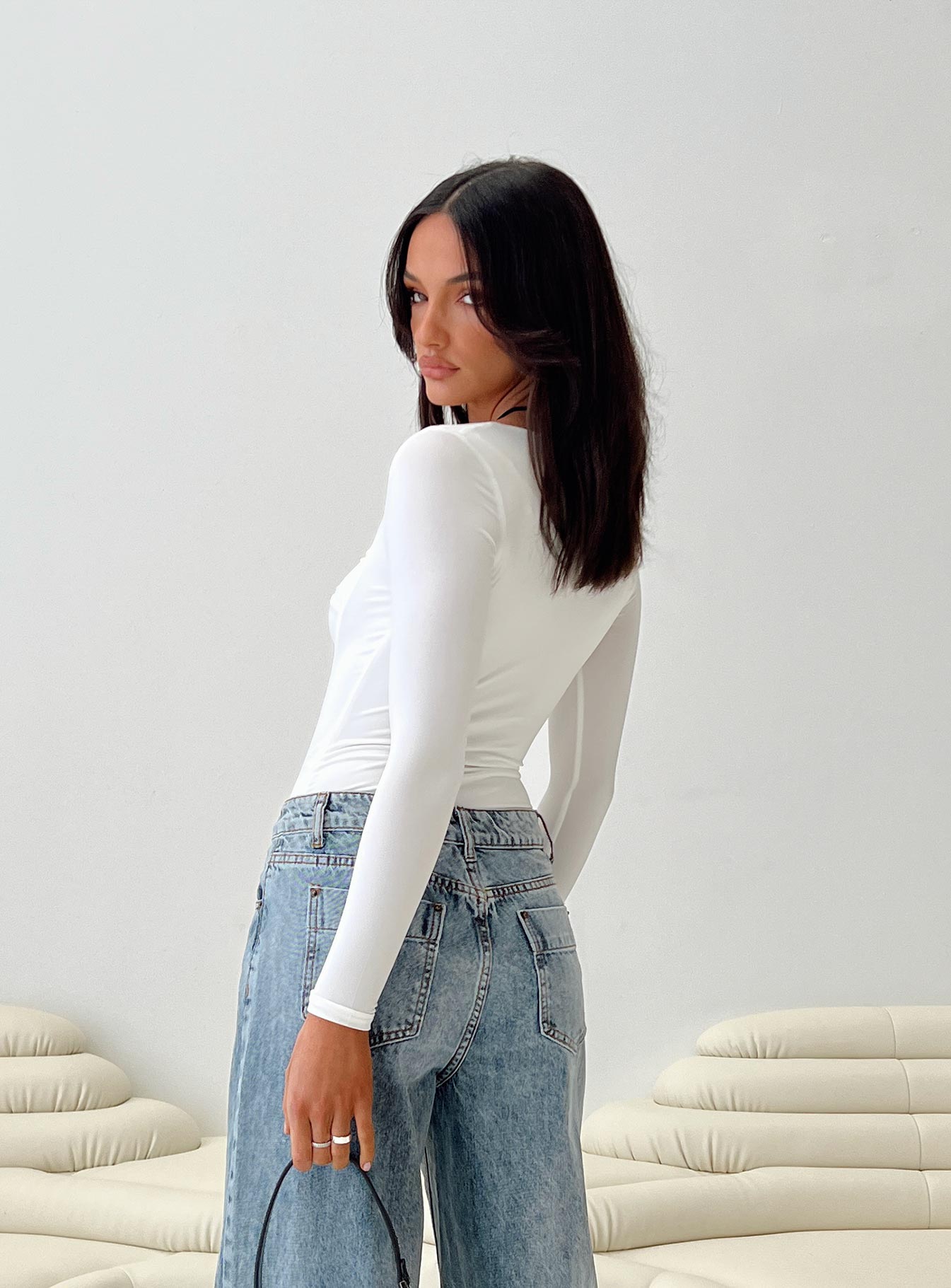 side view of model wearing Princess Polly Zalin Long Sleeve Bodysuit White Full Sleeves 