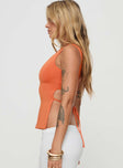 side view of model wearing Princess Polly Uzo Top Orange Sleeveless Crew Neck 