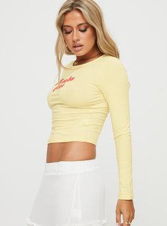 side view of model wearing Princess Polly Je M'en Fous Long Sleeve Top Cream Full Sleeves Crew Neck 
