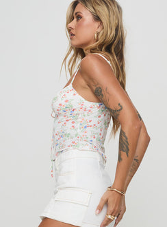side view of model wearing Princess Polly Elyssia Top White Flower Sleeveless Scoop Neck 