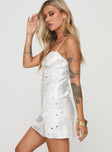 side view of model wearing Princess Polly Snowbird Mini Dress White / Floral Sweetheart Neckline 