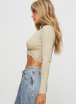 side view of model wearing Princess Polly Carlen Twist Long Sleeve Top Beige Full Sleeves Plunger 