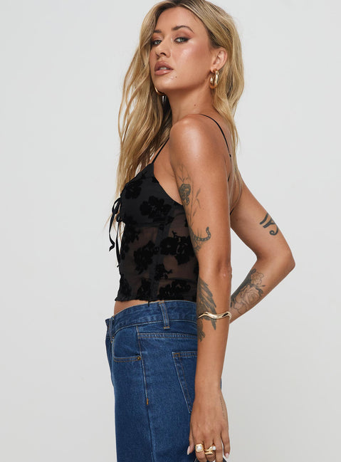 side view of model wearing Princess Polly Numb Top Black Sleeveless Plunger 