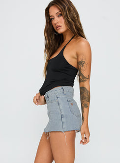 side view of model wearing Princess Polly Make My Day Mid Rise Denim Skort Light Wash High Waisted Shorts 