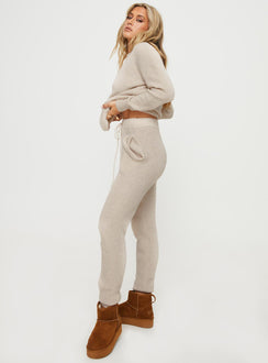 side view of model wearing Princess Polly Abrams Rib Knit Pant Beige High Waisted Pants 