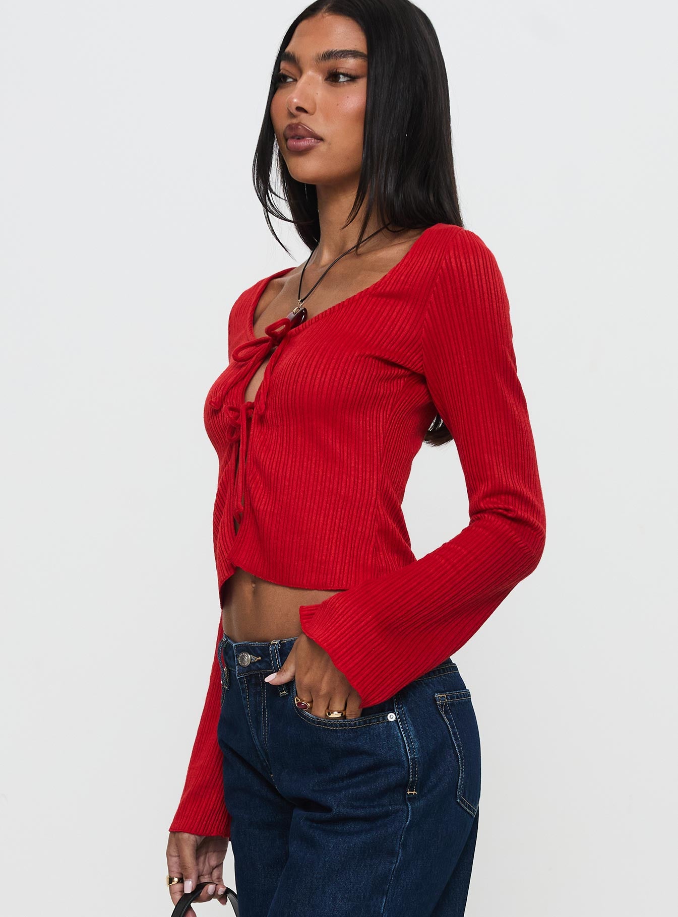 side view of model wearing Princess Polly Rowynne Long Sleeve Tie Up Top Red Full Sleeves Scoop Neck 