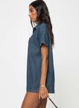 Dark wash denim romper Classic collar, button fastening down front, chest pocket, drop shoulder Non-stretch material, unlined 