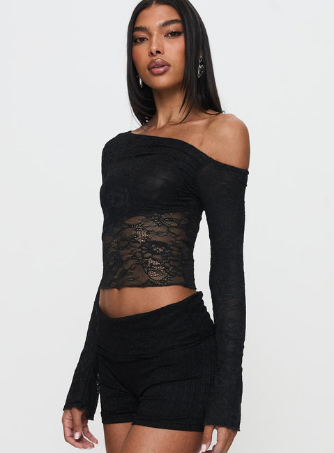 side view of model wearing Princess Polly Tiberius Lace Asymmetrical Long Sleeve Top Black Full Sleeves Asymmetric Neckline 