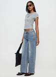 side view of model wearing Princess Polly Skipper Low Rise Baggy Jeans Vintage Blue Low Rise Jeans 