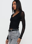 side view of model wearing Princess Polly Tenzin Ruched Top Black Full Sleeves V-Neck 