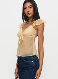 side view of model wearing Princess Polly Keysia Cap Sleeve Sheer Top Apricot Short Sleeves Plunger 