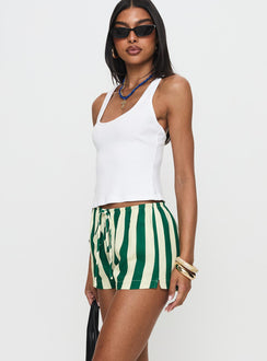 side view of model wearing Princess Polly Salt Air Shorts Green / Cream Stripe High Waisted Shorts 