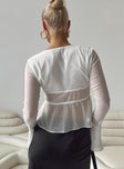 Long sleeve top Sheer material V neckline Lace trim Twin tie fastening at bust